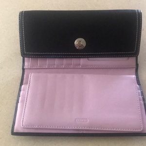 Black and Purple Coach women’s wallet.